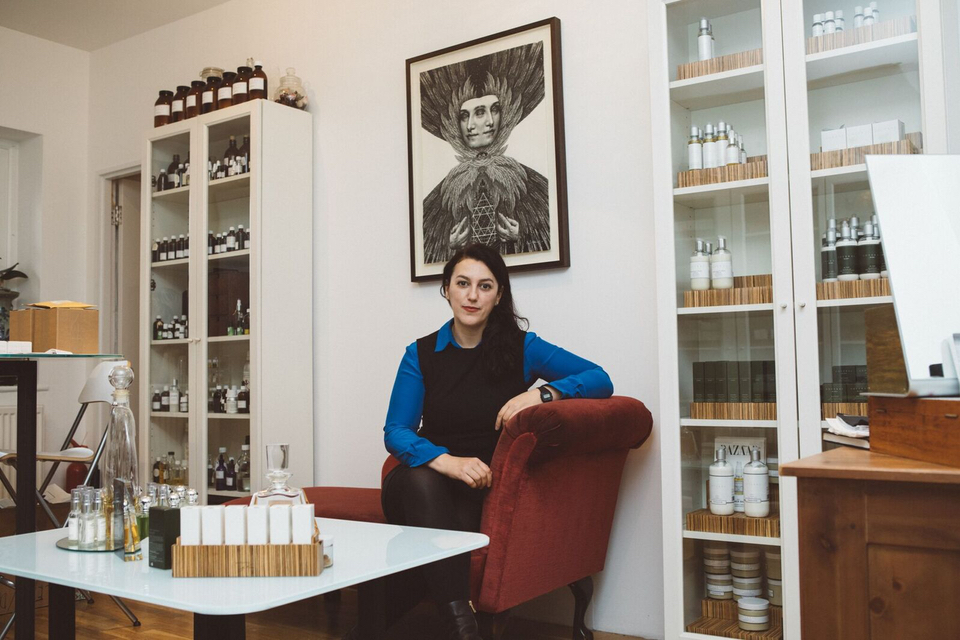 Portrait of Alexandra Soveral surrounded by her products