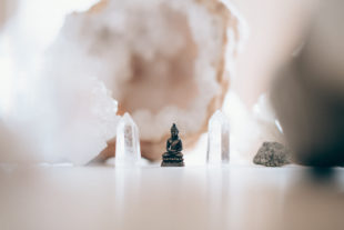 buddha figure and crystals by sam austin